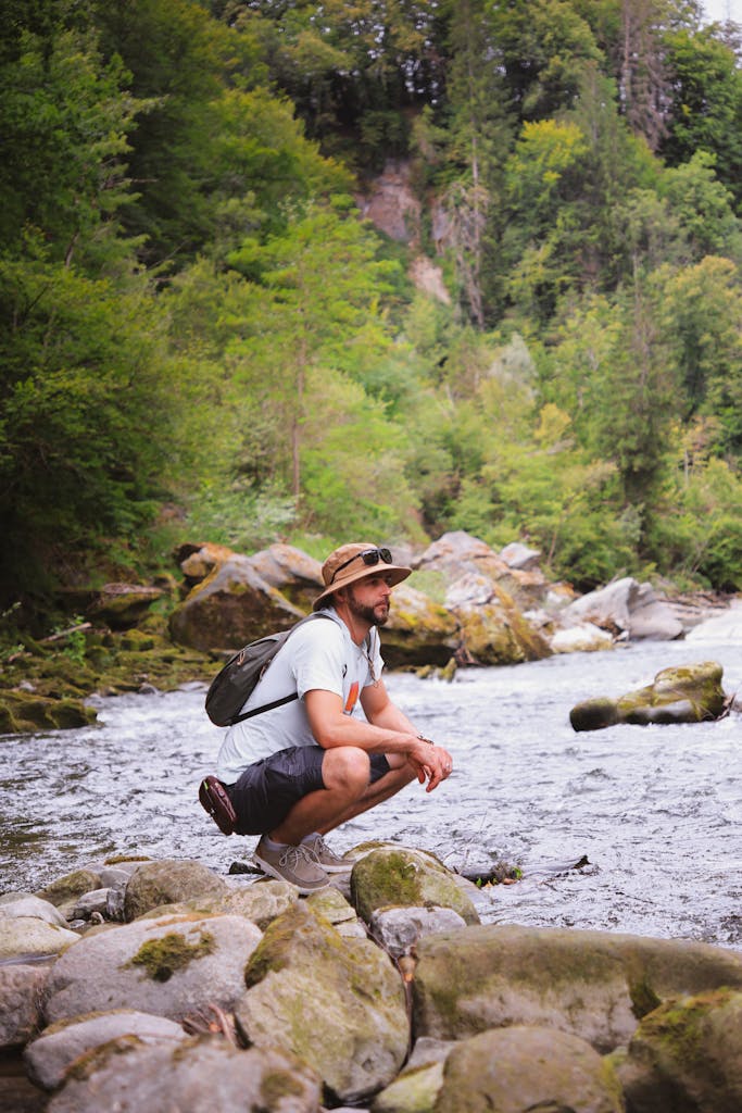 Thoughtful Christian man sitting by the water and reflecting on Christian dating boundaries